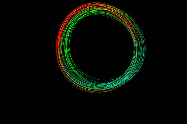 istock Vibrant freeze light circle displays bright colors in swirling patterns against a dark background, creating a stunning visual effect 2239418651