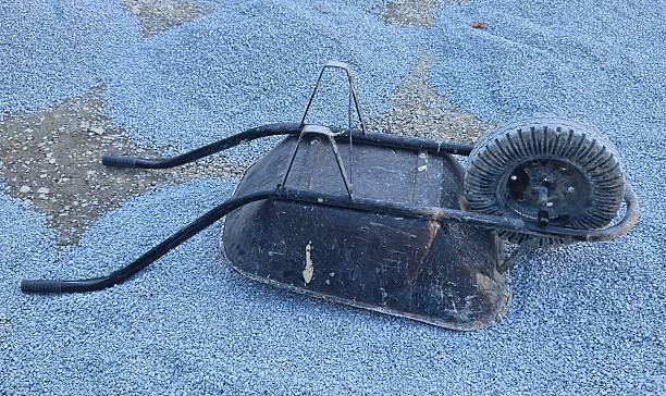 istock wheelbarrow with crushed stone at a construction site 2239425222