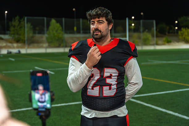 istock American football player doing an interview on field at night 2239425309