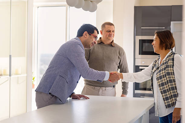 istock Married couple having a meeting with a financial advisor 2239429865