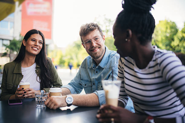 istock Friends having fun during coffee time in a cafe 2239435419