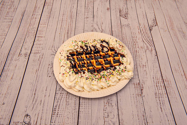 istock waffles a unique touch with creative toppings like caramel sauce, chopped nuts, cookie pieces, ice cream, peanut butter, or shredded coconut 2239435971