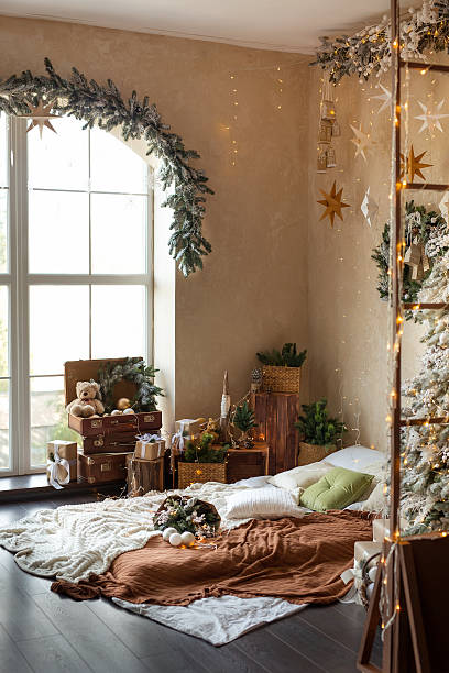 istock Cozy Christmas Bedroom with Tree and Wreath 2239437309
