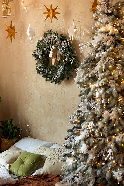 istock Cozy Christmas Bedroom with Tree and Wreath 2239437326