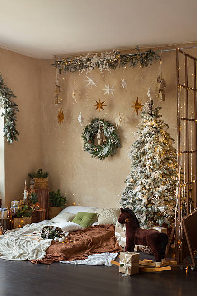 istock Cozy Christmas Bedroom with Tree and Wreath 2239437417