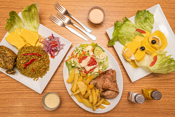 set of typical Peruvian dishes such as huancaina potato, chaufa rice, roast chicken with potatoes