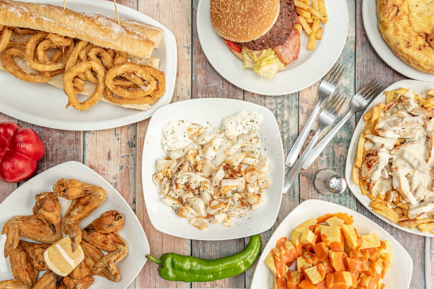 istock Popular tapas served in a Spanish restaurant. Patatas bravas, lemon chicken wings, squid sandwich, grilled cuttlefish with alioli, potato omelette. 2239444264