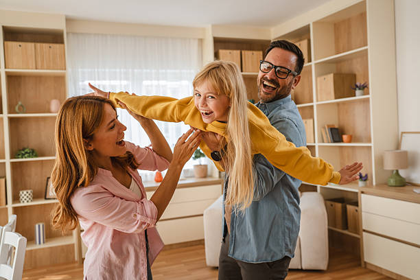istock Parents playing games with daughter at home 2239444299