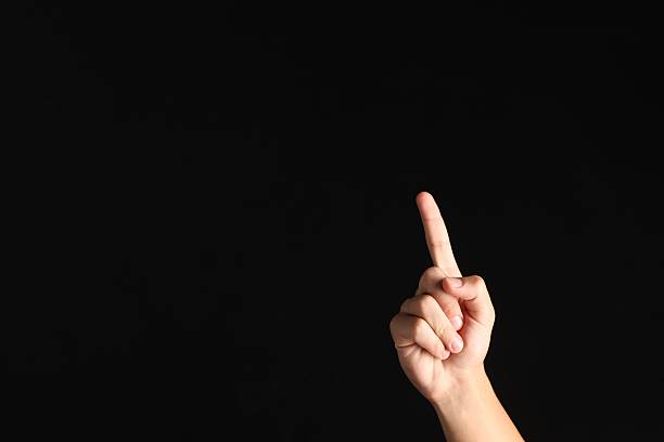 istock Man touching something on black background, closeup. Space for text 2239446474