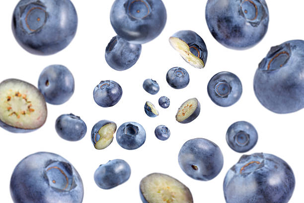 istock Fresh blueberries swirling in air against white background 2239446880