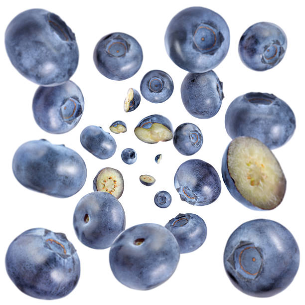 istock Fresh blueberries swirling in air against white background 2239446884