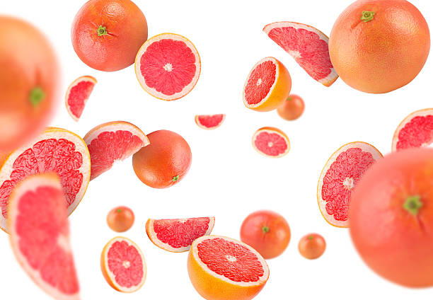 istock Fresh grapefruits swirling in air against white background 2239446896