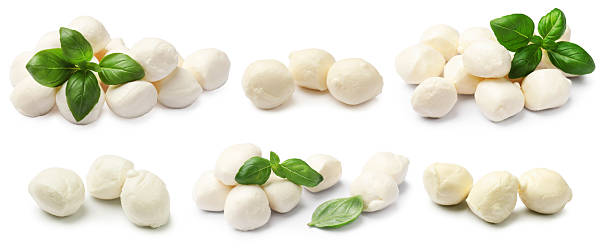 istock Mozzarella cheese balls with fresh basil leaves isolated on white, collage 2239446955