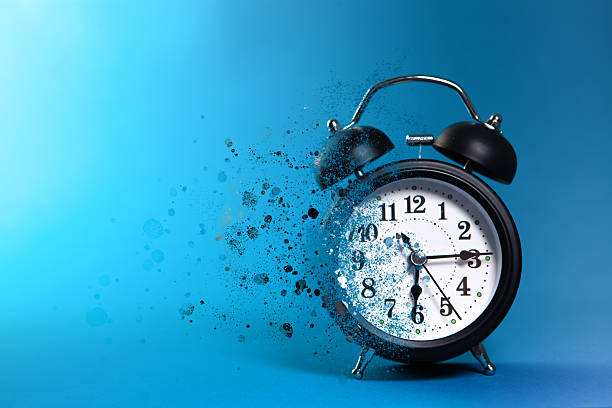 istock Alarm clock on blue background. Time concept. Close up. 2239448160