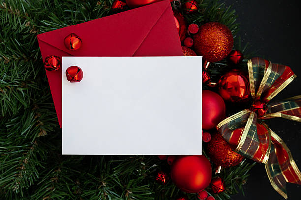 istock Copy space mock up template white paper sheet on postcard with envelope on handmade Christmas wreath. Zero waste eco-friendly Christmas. Sustainable greeting card 2239449990