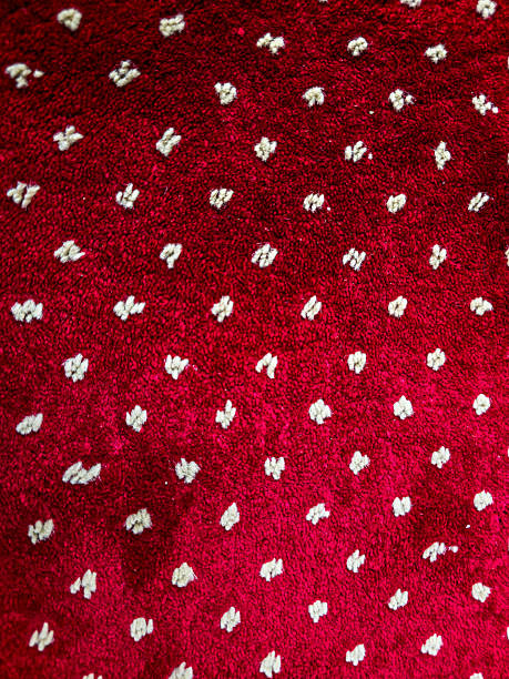 Close-up of Plush Red Carpet with White Dotted Pattern