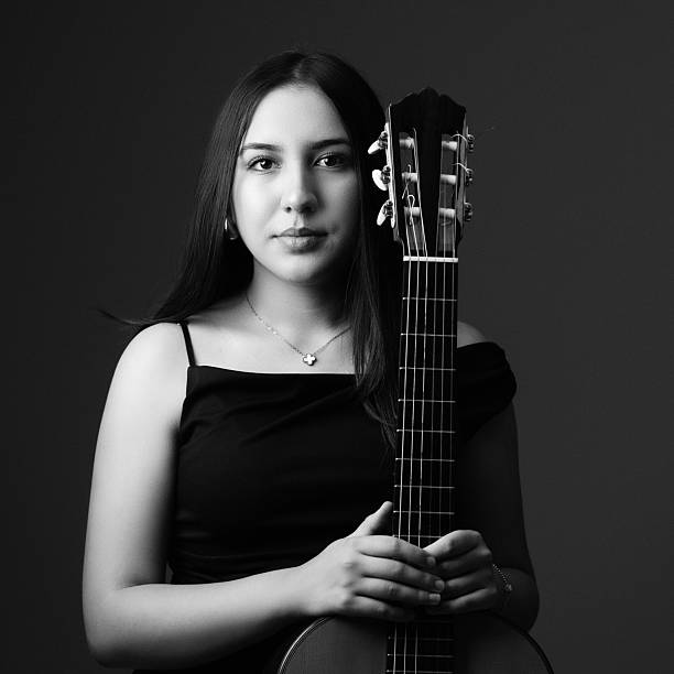 Teenage Girl Posing With Her Classical Guitar
