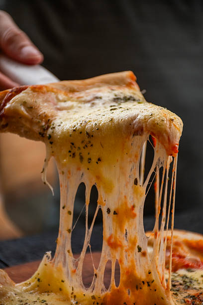 istock serving slice of mozzarella pizza with spatula and melted cheese falling from the slice 2239453050