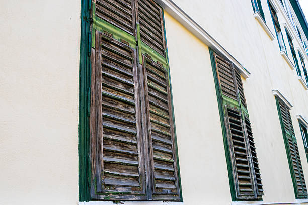 Exterior old wooden window shutters
