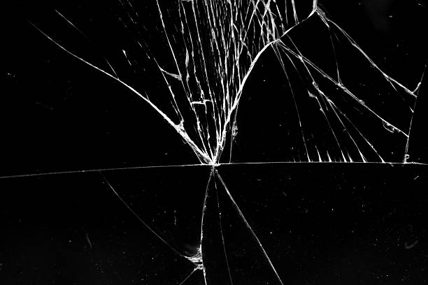 istock cracked glass isolated in black background 2239454752