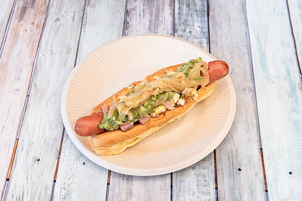 istock Hot dog with avocado, onion, ham and boiled egg 2239457493