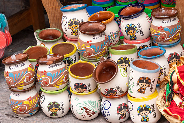 istock A collection of colorful ceramic cups with various designs and patterns. Historic center of Querétaro, colonial architecture, decorations for the celebration of Mexico's Independence Day. 2239461100
