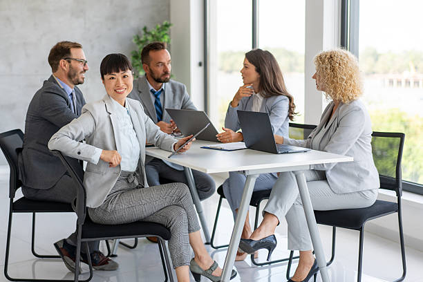 istock Business Professionals Engaged in Conference Discussion 2239461140