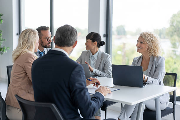 istock Business Team Discussing Strategies in Modern Office Space 2239461146