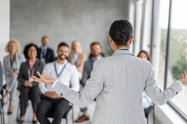 istock Business Professional Discussing Ideas with Engaged Audience 2239461164