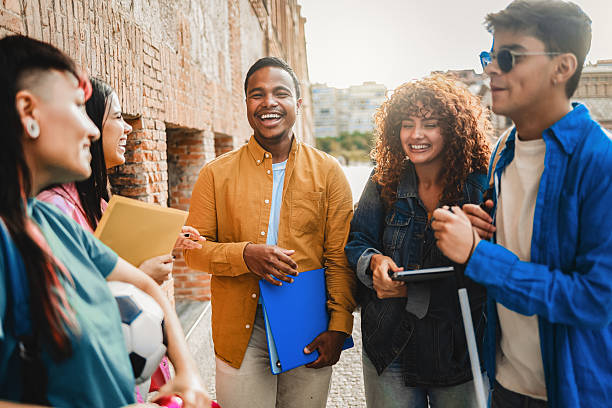 istock Young diverse students smiling outdoors at university campus. Friendship education and inclusion concept 2239466833