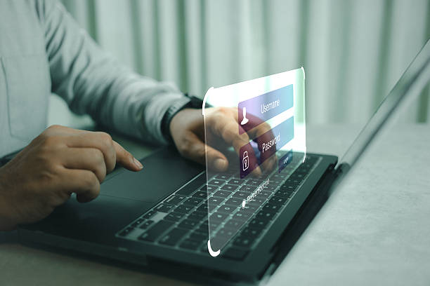 istock Secure internet access and personal information security. Type your login and password on the virtual screen. 2239470696
