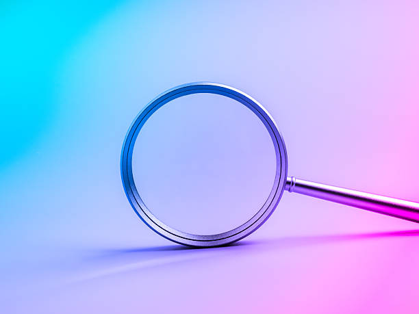 istock Magnifying glass on futuristic gradient background symbolizing searching tool, research, discovery, technology trends, analysis, data exploration, and innovation for modern digital business concepts. 2239475530