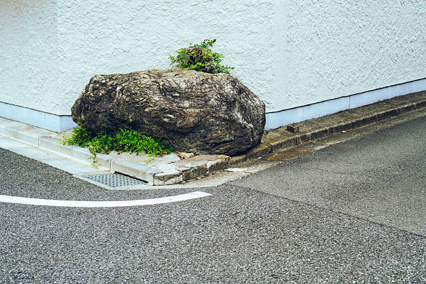 istock Large Rock Placed at a Street Corner 2239476595