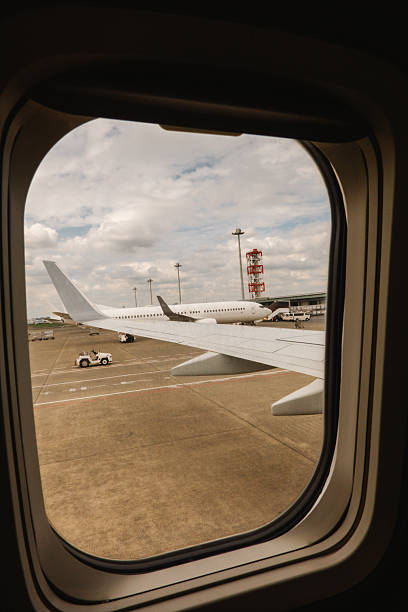 istock View from Airplane Window at Airport Before Takeoff 2239476810