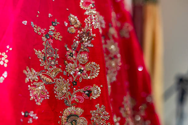istock Indian bride’s traditional wedding outfit textile fabric and pattern close up 2239477592