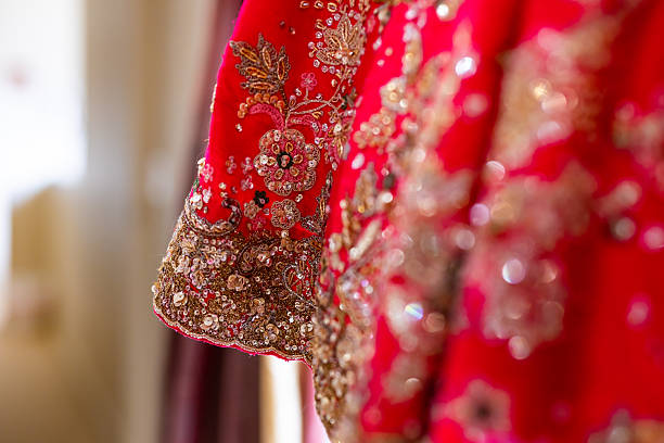 istock Indian bride’s traditional wedding outfit textile fabric and pattern close up 2239477593