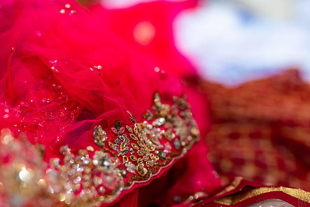 istock Indian bride’s traditional wedding outfit textile fabric and pattern close up 2239477609