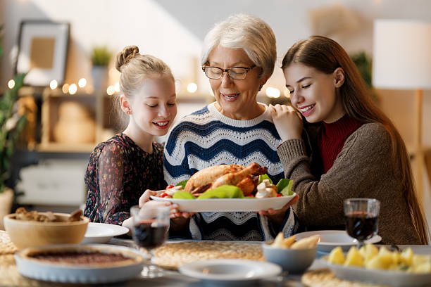 istock Family celebrating Thanksgiving Day 2239477619
