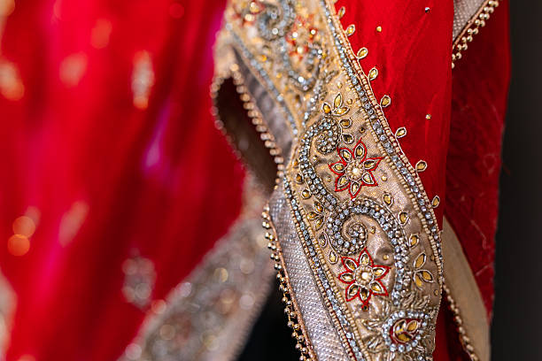 istock Indian bride’s traditional wedding outfit textile fabric and pattern close up 2239477700