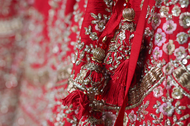 istock Indian bride’s traditional wedding outfit textile fabric and pattern close up 2239478254