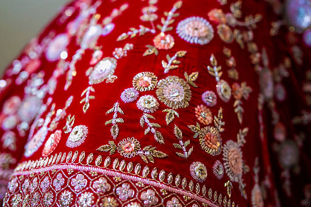 istock Indian bride’s traditional wedding outfit textile fabric and pattern close up 2239478743