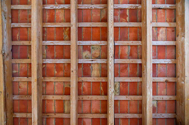 Rustic Background: Detail of Wooden Framework and Brick on Ceiling.