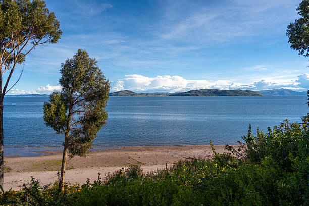 istock Lush green landscape overlooking Lake Titicaca from Llachon, Peru 2239483635