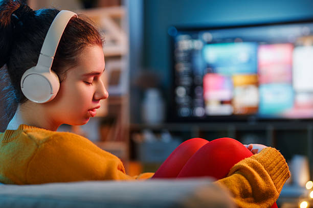 istock woman watching TV at home 2239484806