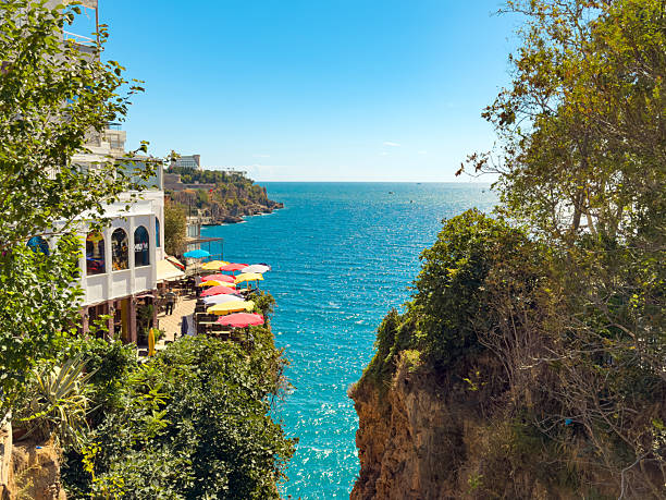 istock Kadinyari Canyon, a dramatic cliffside canopy in Antalya that opens onto the sparkling Mediterranean sea and umbrellas 2239484813