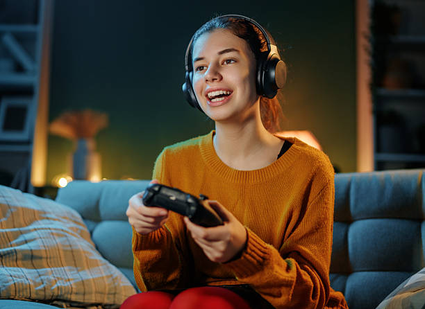 istock woman is playing video game 2239484846