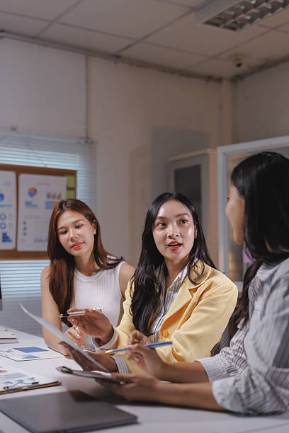 istock Businesswomen having meeting in office discussing documents 2239487918