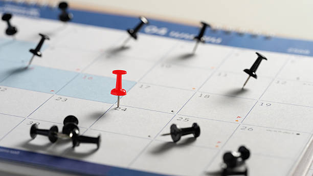 istock Red push pin marking an important date. Appointment reminder and planning concept 2239488301