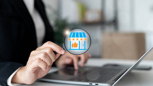 istock A business person analyzing five-star store rating and customer trust symbol through a magnifying glass, representing online reputation, review, and brand credibility concept. 2239489014