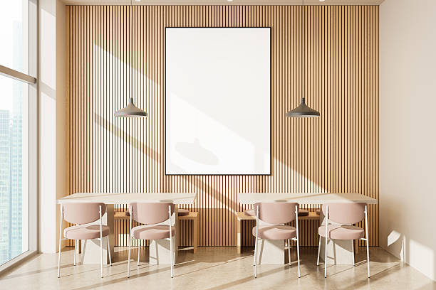 istock Modern dining area with vertical wooden slat wall and blank poster mockup framed centrally above minimalist tables and pastel chairs in sunlight. 3D Rendering 2239489300